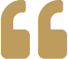 Golden quotation mark symbol on white background.