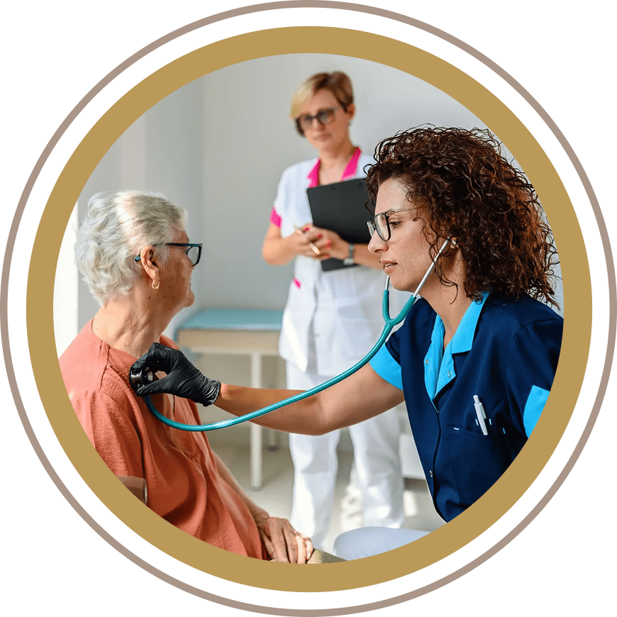 Nurse checking blood pressure of elderly woman with doctor observing.
